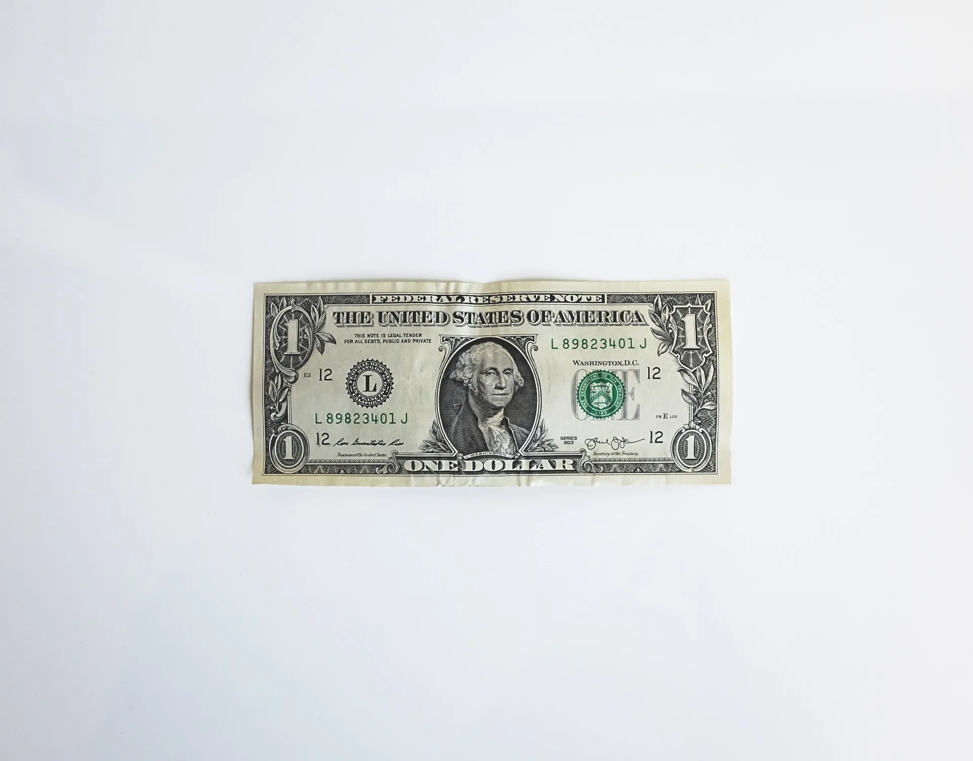 Billete de un dólar sobre fondo blanco