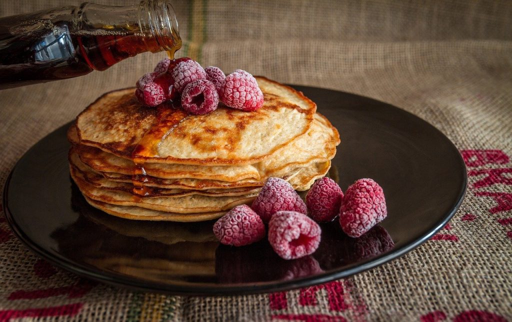 pancakes, maple syrup, raspberries